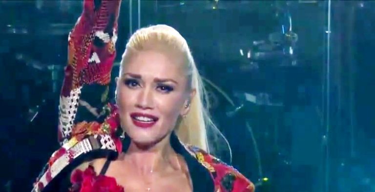 Gwen Stefani Goes Naked Under Robe With Fishnet Stockings [Credit: YouTube]