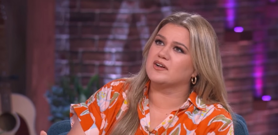 Kelly Clarkson Wears Orange Floral Print Dress [The Kelly Clarkson Show | YouTube]