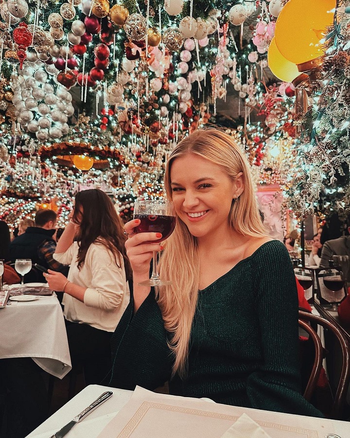 Kelsea Ballerini Enjoys Red Wine In Green Dress [Kelsea Ballerini | Instagram]